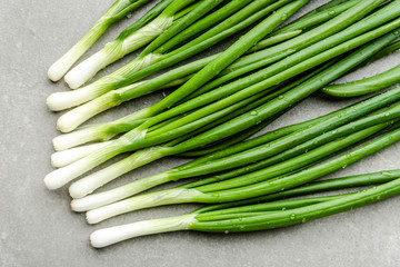 Fresh green onion, spring vegetables, top view
