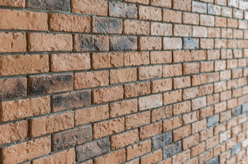 Rough texture red brick wall interior background in natural light.