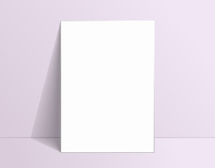White poster mockup standing on the floor near pale pink wall. Blank Canvas Mockup for design