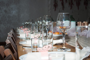 Empty glasses in restaurant. Cutlery on the table in a restaurant table setting, knife, fork, spoon, interior. Selective soft focus on Wine glass on dining table in restaurant.