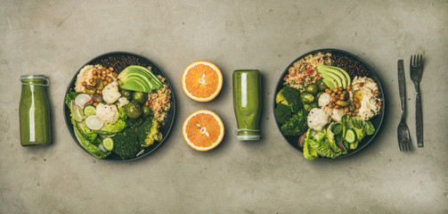 Healthy dinner, lunch setting. Flat-lay of vegan superbowls or Buddha bowls with hummus, vegetable, salad, beans, couscous, avocado and green smoothies in bootles, top view. Clean eating food concept