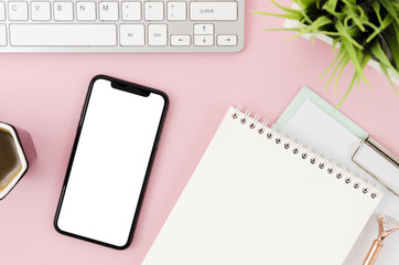 Top view smartphone template over workspace