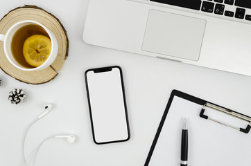 Top view smartphone template over workspace