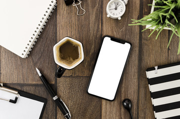 Top view smartphone template over workspace