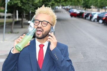 Modern African businessman enjoying a refreshing soda 