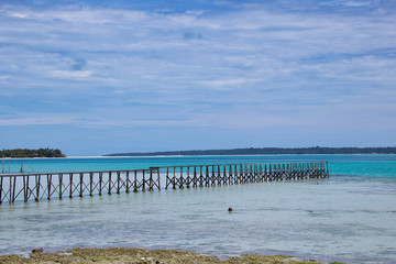 wooden pier in a tropical beach in maratua island