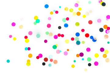 Colorful confetti on white background.