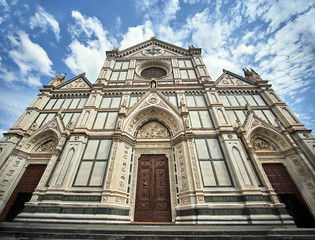 Fototapeta na wymiar Facade of a historic church in the city of Siena, Italy.
