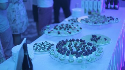 Buffet table with snacks at a party. Buffet table of reception with burgers, cold snacks, meat and salads