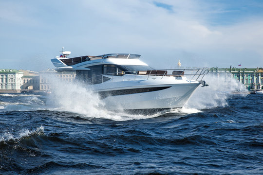 white yacht at river in city, luxury lyfe
