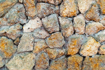 Laying untidy wild stone at close range
