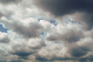 Naklejka na ściany i meble Sky background with clouds before the rain
