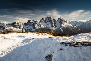 Obraz premium view on scenic snowy mountain range landscape in sunlight, view from monte piana in dolomites, italy