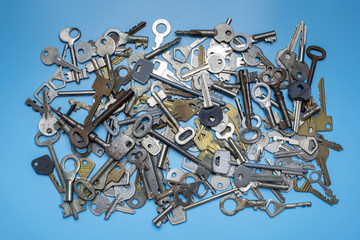 Keys set on blue background. Door lock keys and safes for property security and house protection....