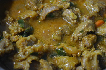 Cooking, tasty stewed meat of a cow with curry, onions and sliced carrots. Great food, healthy food, life and beauty.