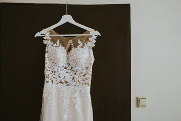 white wedding dress on a stand