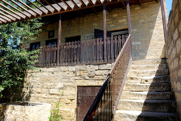 Ancient stone house with a balcony