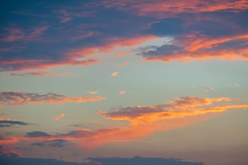 Obraz premium Clouds at sunset before rain blue orange and dark sky