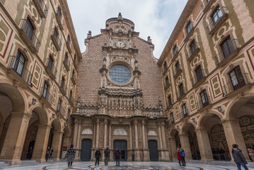 MONSERRAT,SPAIN - FEBRUARY 20, 2019: Facade of the Basilica of Montserrat, Catalonia.