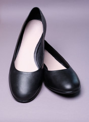 Female black leather ballet shoes