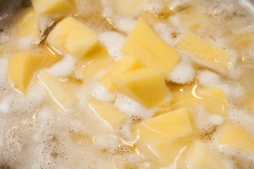 The foam formed during the preparation of boiled potatoes.