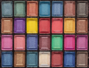 Colorful eye shadows palette. Makeup background. close up