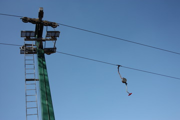 ski lift or skilift. cable car pole on snow slope in summer.