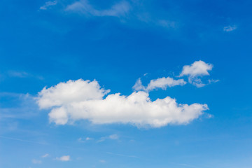 Naklejka na ściany i meble White clouds on blue sky in sunny weather_