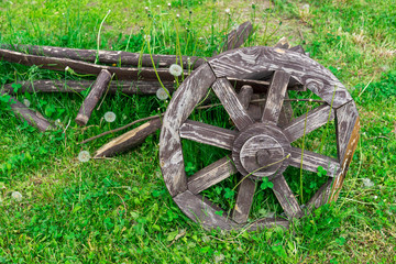 Old wooden cartwheel. Wheel from the old horse-drawn cart.