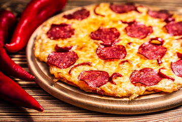 Pizza with cheese and salami