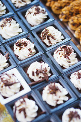 Sweet desserts, pastries on the table during the event. Catering servicing of guests and participants during mass events.