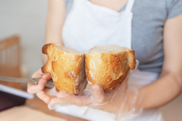 Fresh bread in female hands