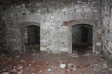 Fort Bastione, a nineteenth-century military fortress, abandoned to the neglect of nature. distressing stone construction inside and out. wild nature covers the whole castle