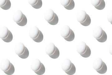 Fresh eggs isolated. White eggs pattern over white background