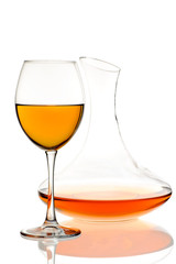 Amber wine. Wine in a glass and decanter. Traditional Georgian wine according to ancient technology. Isolated on white background. Close up and vertical orientation.
