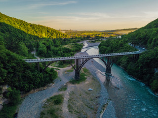 Aerial view of stone bridge over gorge of river Gumista, Abkhazia