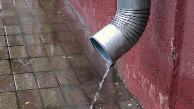 Drainpipe in the rain.