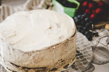 beautiful white cream cheese cake with different summer berries