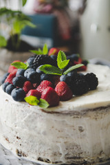beautiful white cream cheese cake with different summer berries