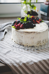 beautiful white cream cheese cake with different summer berries