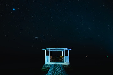 white pavilion with the starry sky in the night