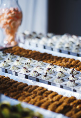 Sweet desserts, pastries on the table during the event. Catering servicing of guests and participants during mass events.