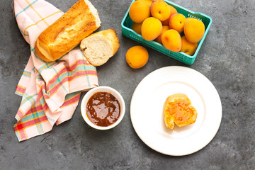 breakfast with apricot jam and slice of bread