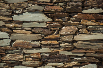 Wall made of slate stone making a quaint pattern