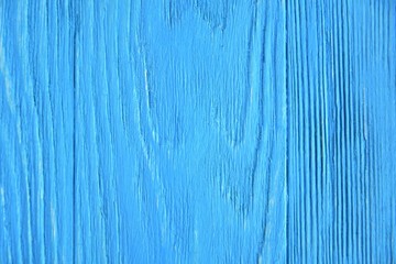 Bright blue textured wood background. Empty wooden backdrop with rough surface. Blank wooden backdrop with grungy natural wood plank. Wooden table with a beautiful structure painted in blue