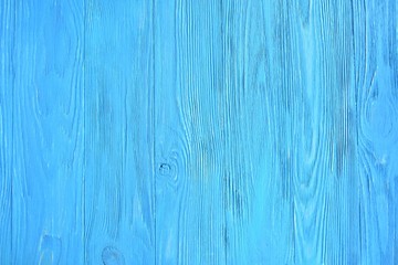 Bright blue textured wood background. Empty wooden backdrop with rough surface. Blank wooden backdrop with grungy natural wood plank. Wooden table with a beautiful structure painted in blue