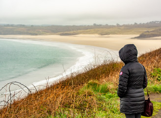 woman walking on beach