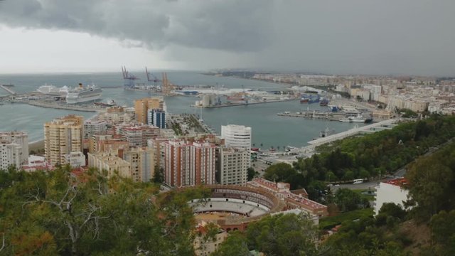 Malaga with Placa de Torros from castle in sunny time. Andalusia, Spain 