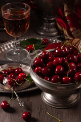 Vintage still life with ripe cherry and pewter