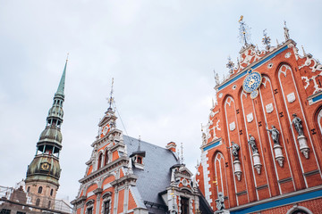 Obraz premium House of the Blackheads and Saint Peters church in Riga in a beautiful summer day, Latvia